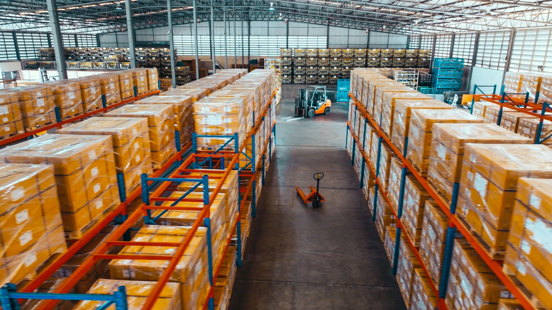 Warehouse shelves with packaged goods, representing logistics and data handling