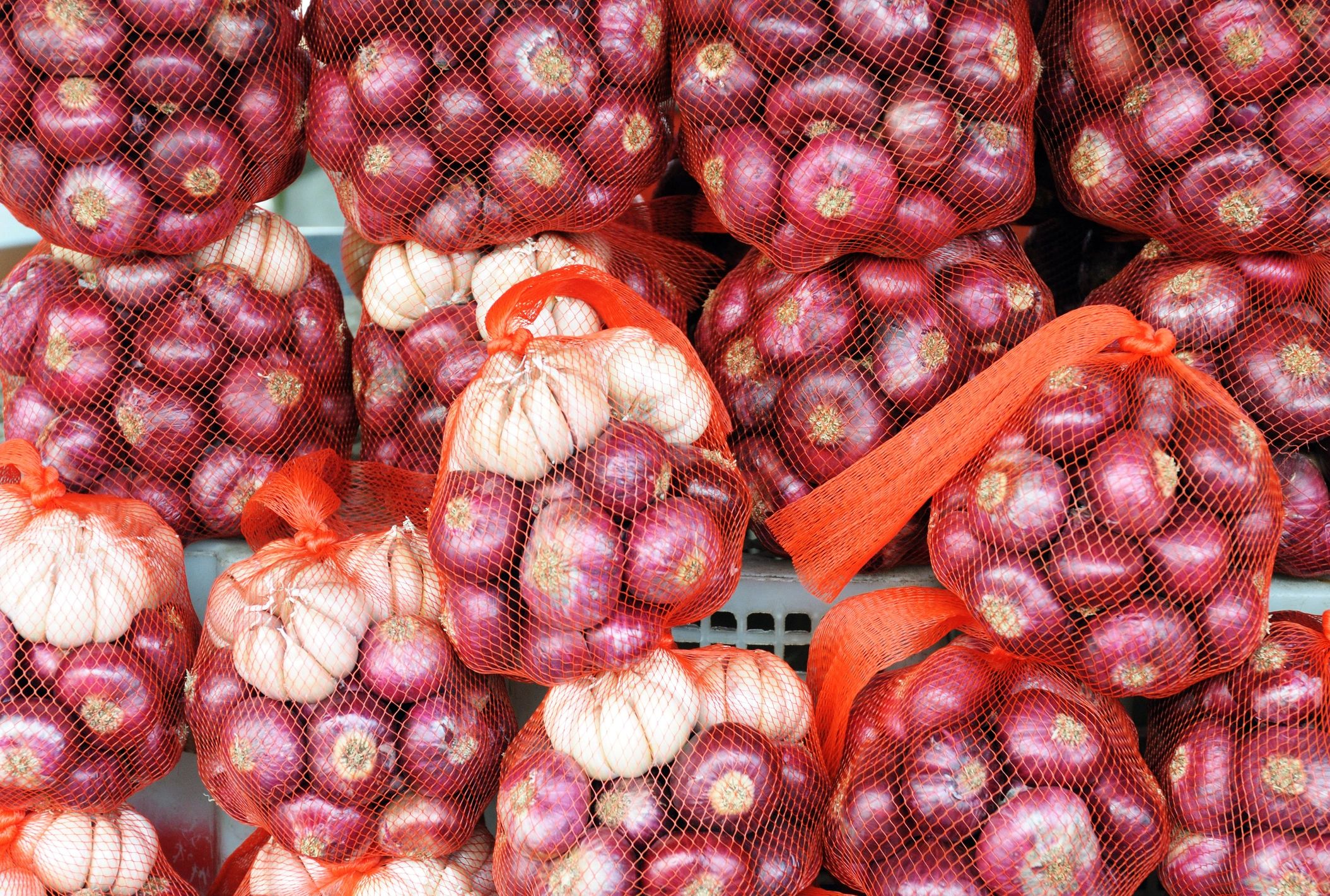 Onions and garlic packaged for wholesale distribution